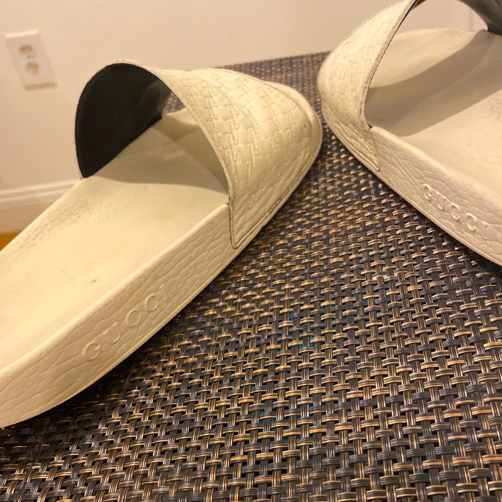 Gucci flip flops size11 gut the Gucci symbols all over the top of the sandles